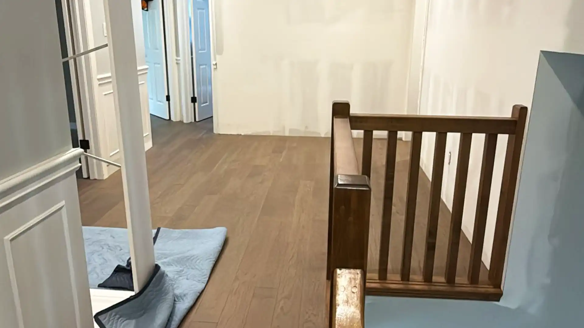 Seamless flooring transition in a modern Waterloo home featuring durable Canadian hardwood.