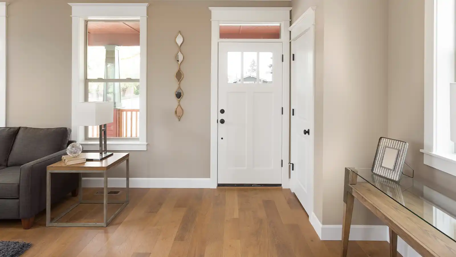 Canadian home entryway with protective floor mats and durable flooring designed to prevent winter salt damage and moisture buildup during snowy seasons.