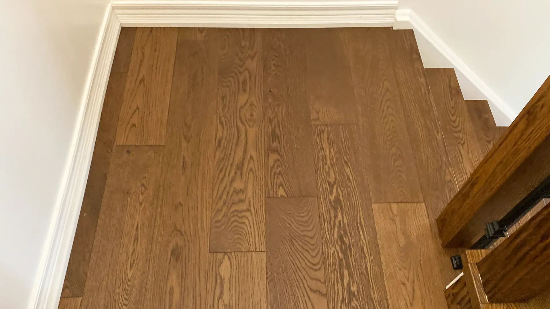 Complete Hardwood Floor and Stair Transformation in a Residential Home by Petun Flooring