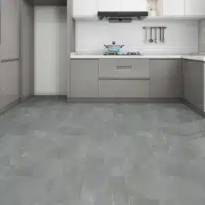 Carbon 7mm NAF Aquatile rigid core SPC tile flooring in a dark grey concrete finish