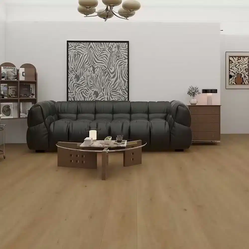 Woden 1004 River Clay SPC vinyl plank floor in a living room with a dark sofa